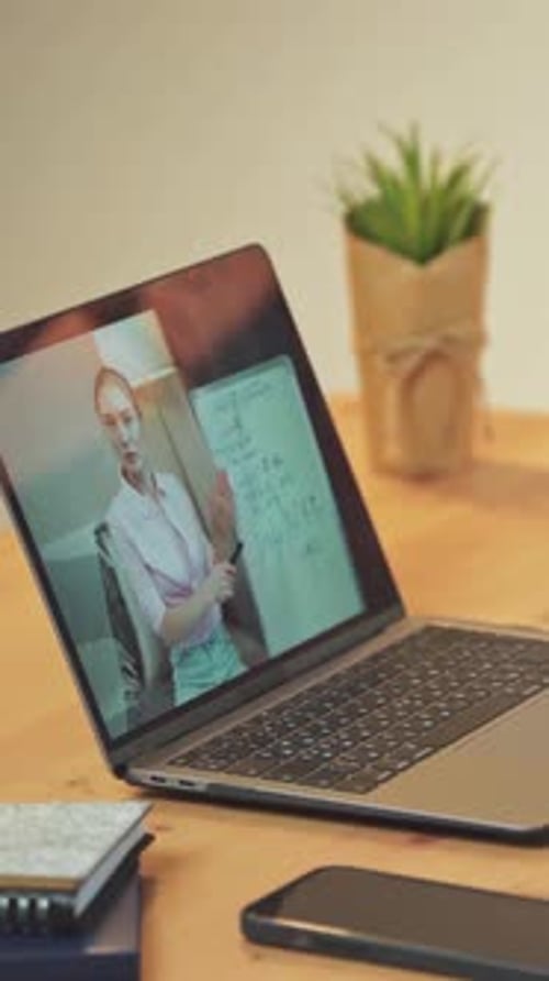 Vertical Video Laptop Screen View Woman Teacher Makes a Homeschooling Online By Video Call Video