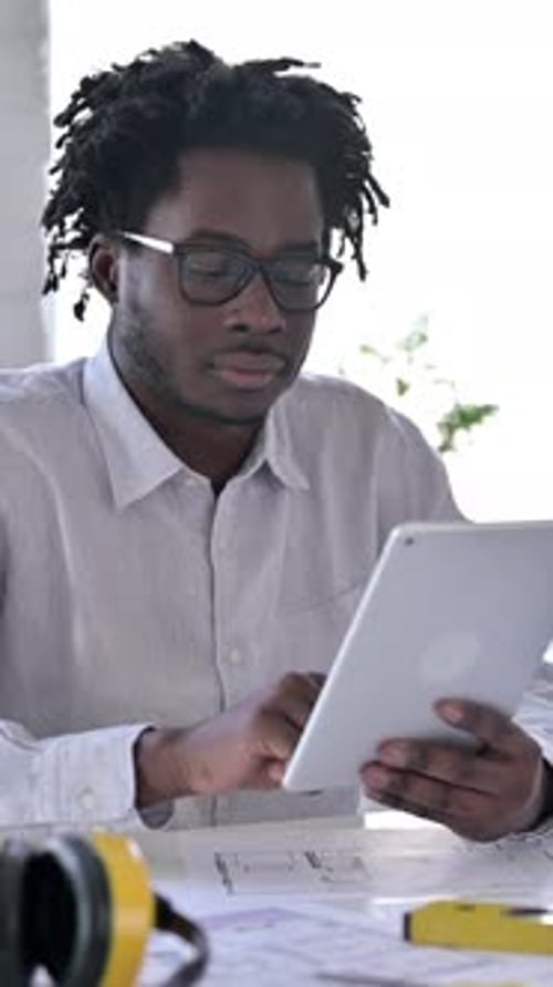 African Engineer Using Tablet, vertical video