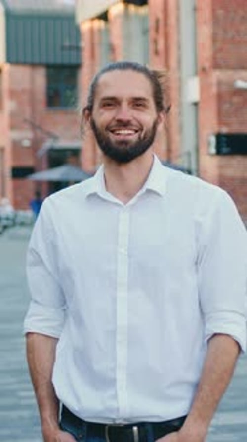 Portrait of Bearded Handsome Business Man Smiling on Camera While Standing Outdoors Closeup Positive