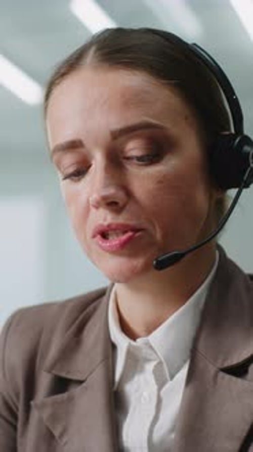 Woman Speaking with Headset in Professional Office