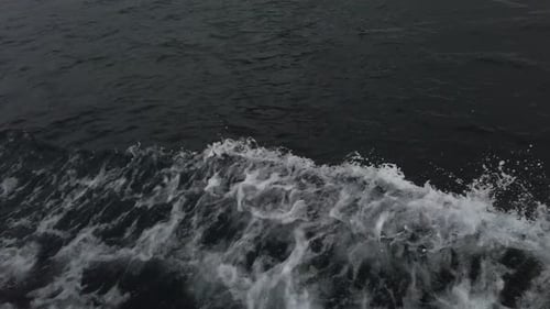Ferry Wake On Side Of Boat While Traveling On The Ocean. - Tracking Shot