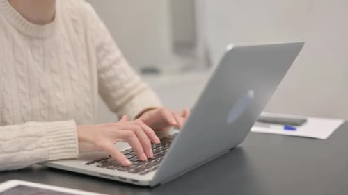 Close up of Female Hands Typing on Laptop