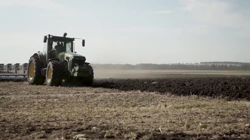 Tractors plowing the field in Ukraine