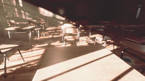 View to Classroom with Tables and Small Blackboard and Grungy Walls