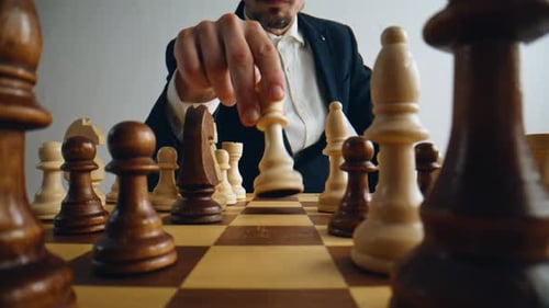 Unknown Man Playing Chess Logic Board Game Closeup Player Hand Moving Figure