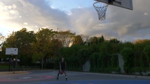 Basketball Player Dribbling And Doing The Jump Shot At The Basketball Court In Vancouver, Canada - w
