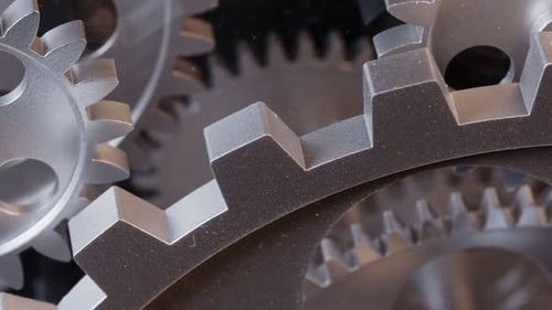 Close Up of Silver Metal Gears Rotating