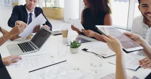 Business, meeting and marketing team working in the office analyzing research sales data