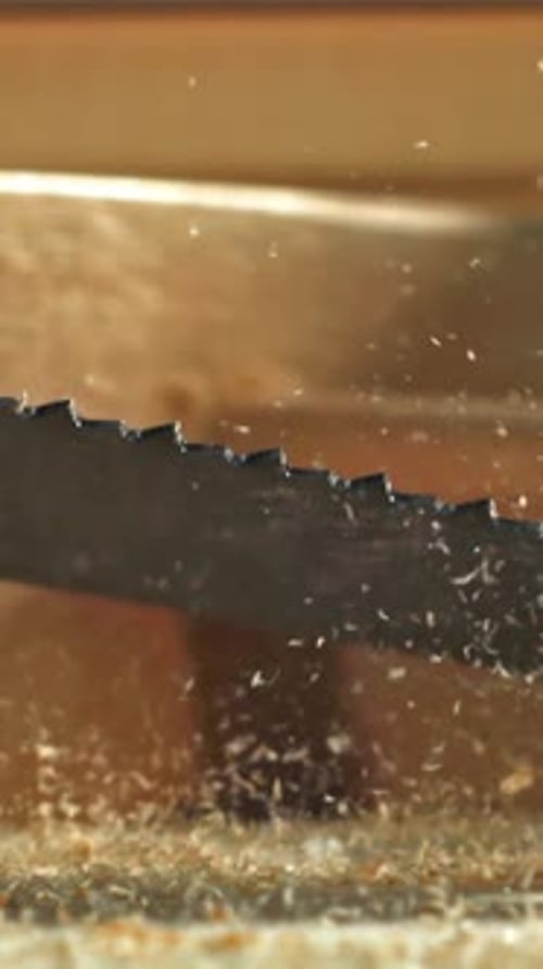 A Hand Saw Falls on the Carpenter's Worktable Filmed on a Highspeed Camera at 1000 Fps