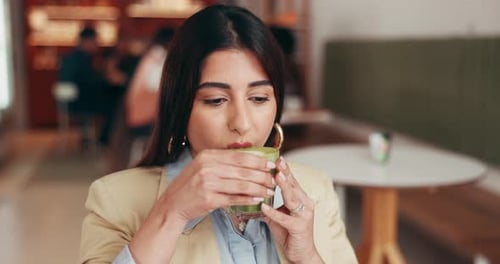 Drinking, matcha and happy woman in cafe for peaceful morning, contemplating or relax on weekend