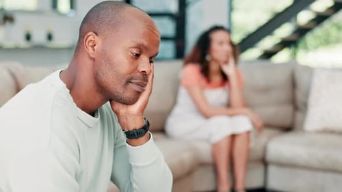 Upset Couple Sitting on a Couch in Silence