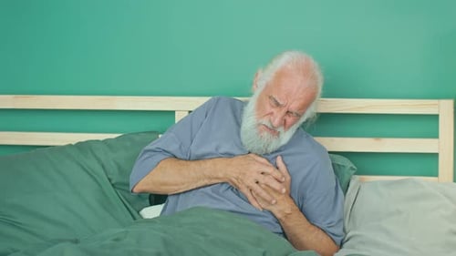 Elderly Man Holding His Chest With Both Hands He Has Difficulty Breathing