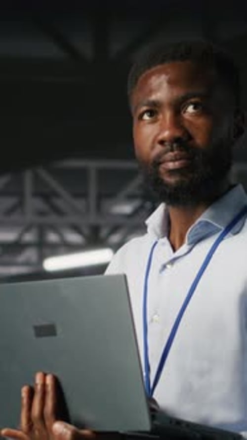 Vertical Video Engineers in Data Center Use Laptop to Monitor Neural Network LLM Visualization