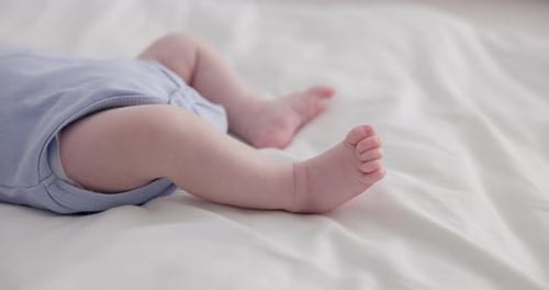 Infant Lying on Back Showing Legs and Feet