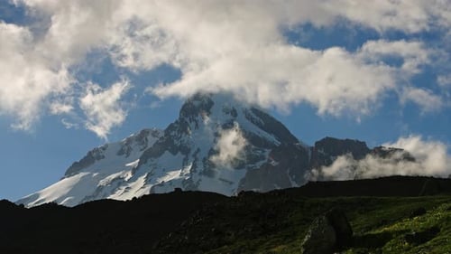 Majestic Kazbegi Mountain in Caucasus Captured in Stunning Timelapse Snowcapped Peaks Moving Clouds