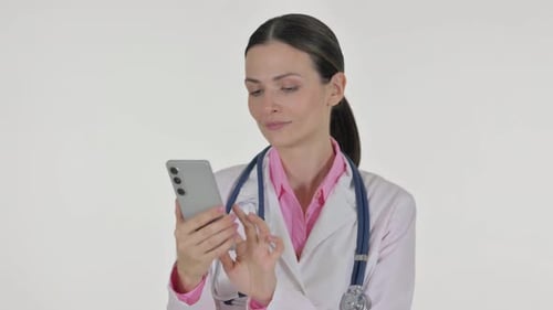 Female Doctor Uses Smartphone in Studio