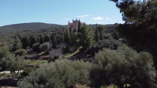 Aerial view of historic building surrounded by forest in spain