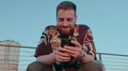 close-up of male hands holding a smartphone texting via messenger online communication