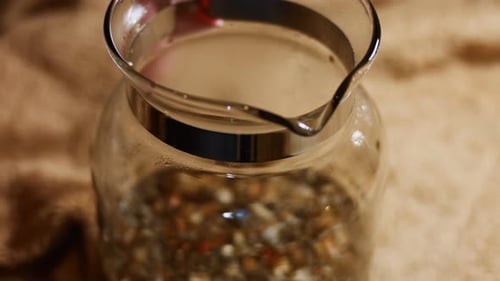 Top View of a Glass Teapot with Hot Tea