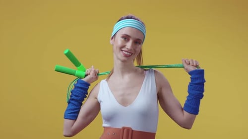 An Energetic Fitness Enthusiast Dressed in Colorful Retro Sports Attire and Accessories