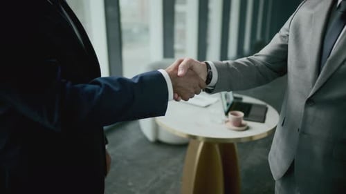 Business Handshake in Modern Office Building