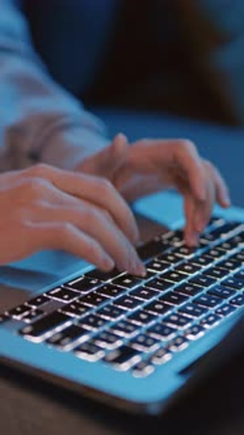 Female Hands Typing Something on Laptop Keyboard