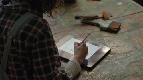 Woman Drawing On Tablet Computer