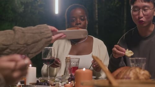 Friends Gather for an Outdoor Dinner at Night