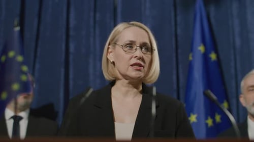 Female Politician Speaking to Audience at European Union Event