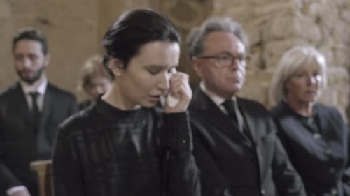 Mourners at funeral service