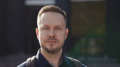 City Street Portrait of a Man in a Shirt and with a Backpack Modern Lifestyle in the City
