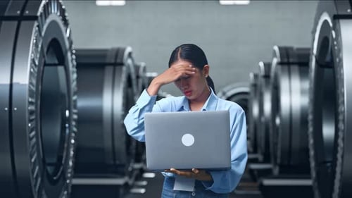 Asia Female Professional Worker Headache When Use Laptop In Metal Factory