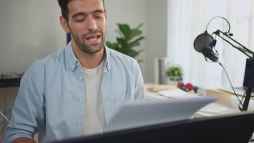 Young Adult Man Playing Piano and Singing