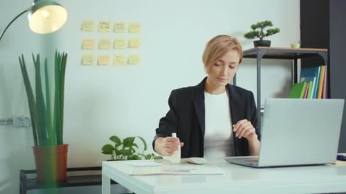 Close Up Young Woman Applying Sanitize Spray Rubbing Hands Before Use Laptop Computer Work Office