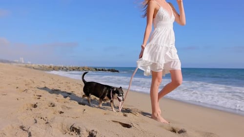 Attractive Woman Walking on the Beach