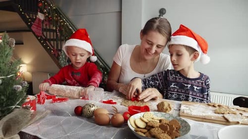 Mother and Children Making Christmas Cookies Together