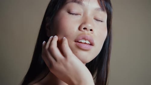 Asian woman beauty session in studio.