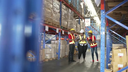 Logistic workers are working at logistic warehouse.