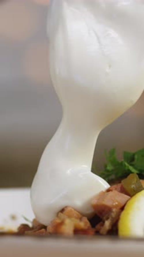Closeup of Some Person's Hand Adding Sour Cream at the Bowl with Solyanka Stock Footage Russian