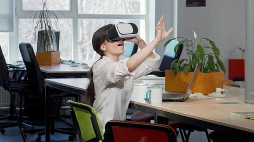 Woman Using Virtual Reality Headset in Office