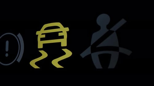 Car Dashboard Warning Lights Illuminating on Black