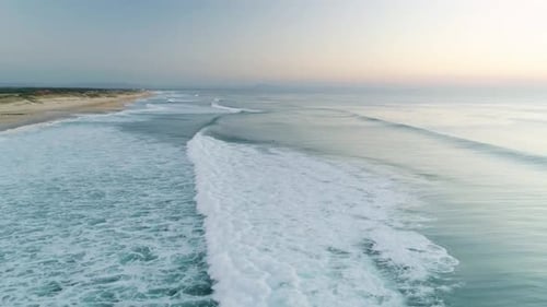 Aerial view of beach and ocean waves, France.