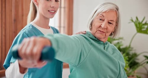 Senior Woman Exercising with Physical Therapist Indoors