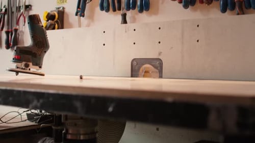 Close Up of Electric Router on Wood Shaper in Carpentry Studio