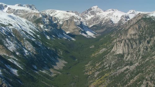 The Snowcapped Peaks Steep Cliffs and Dense Forests of the Absaroka Mountain