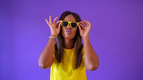 Beauty African Urban Woman Playing with Sunglasses