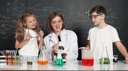 Enthusiastic Children Learn Science With Scientist in Lab