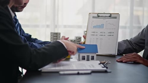 Businesspeople sell buy mortgage and signing agreement for apartment financial