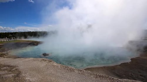 Steam Rising From Hot Spring In Yellowstone National Park, USA. panning left