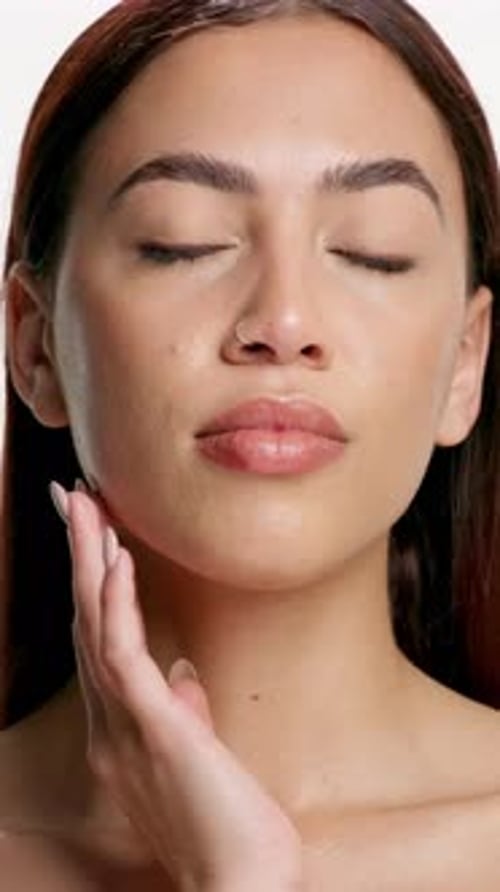 Face, woman and touch for skincare in studio for beauty, smooth healthy and dermatology results